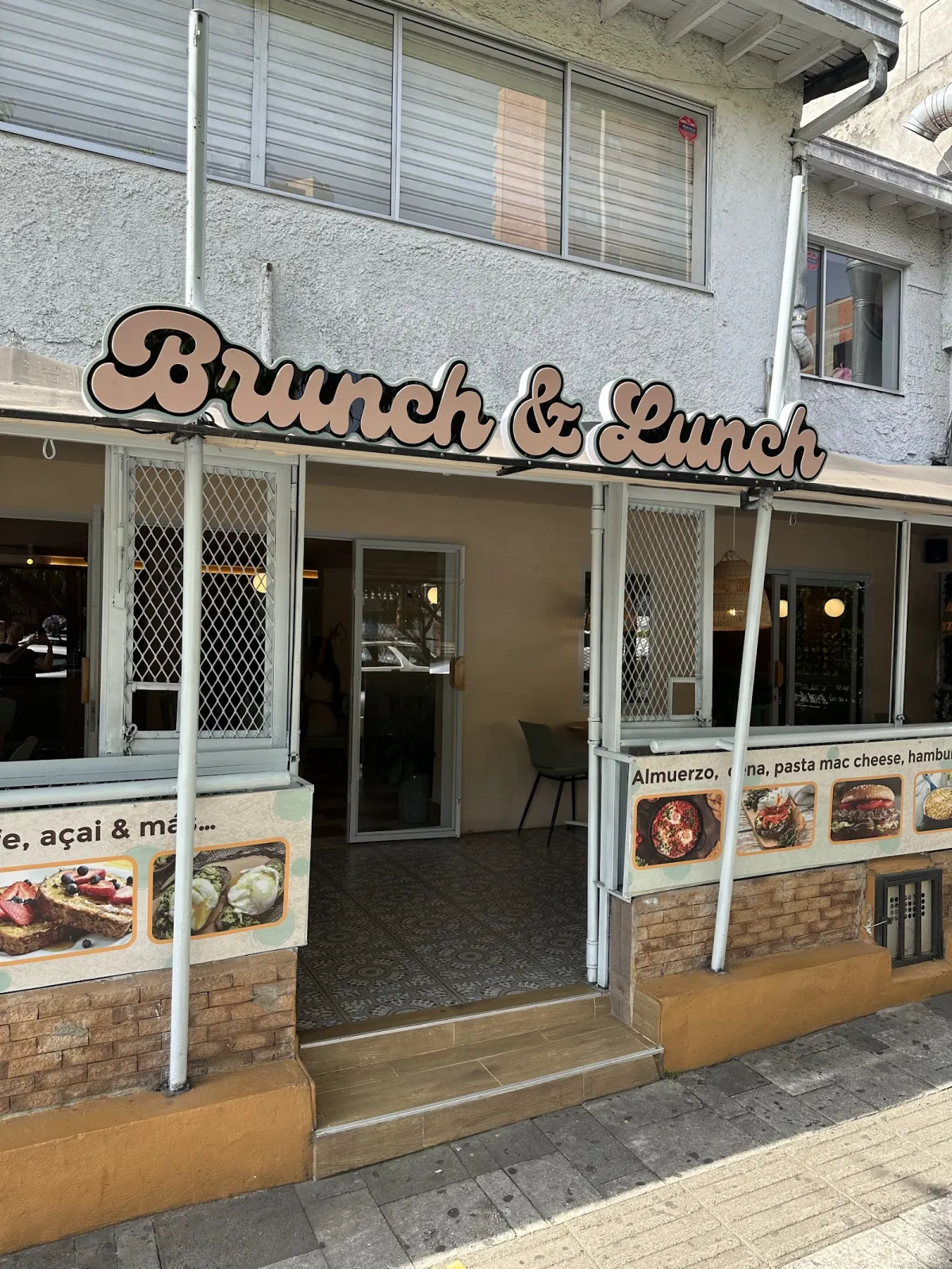 The storefront of Brunch & Lunch with its sign above the entrance