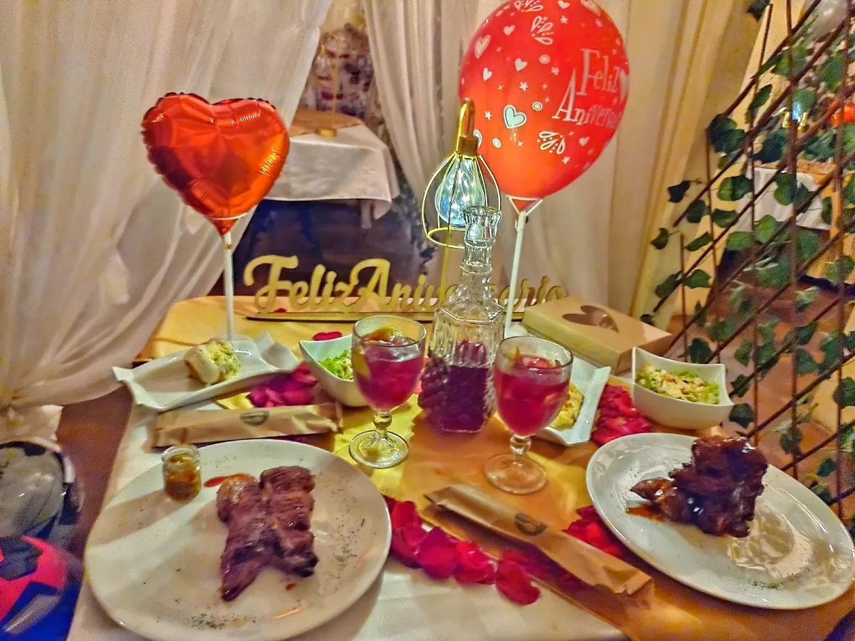 A table at Clandestino decorated for an anniversary with heart-shaped balloons